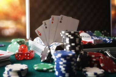 Live dealer placing ball on spinning roulette wheel
